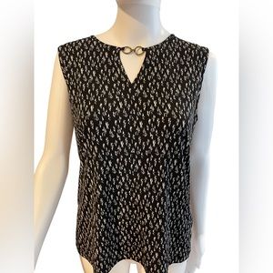 Jones New York Signature Black & White tank with brass/gold accessory in front.